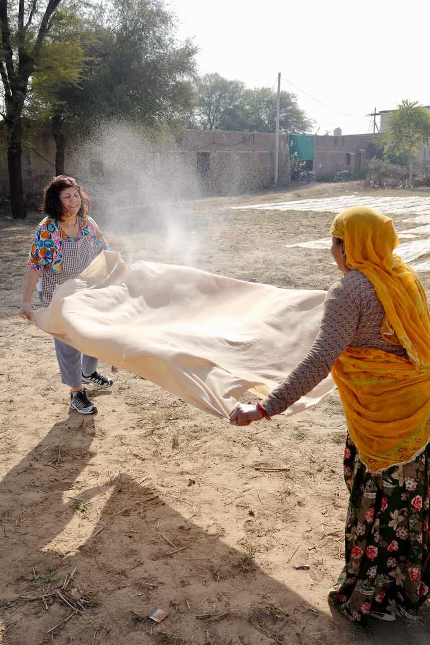Drying cotton fabric for block printing during a long workshop in block printing workshop.