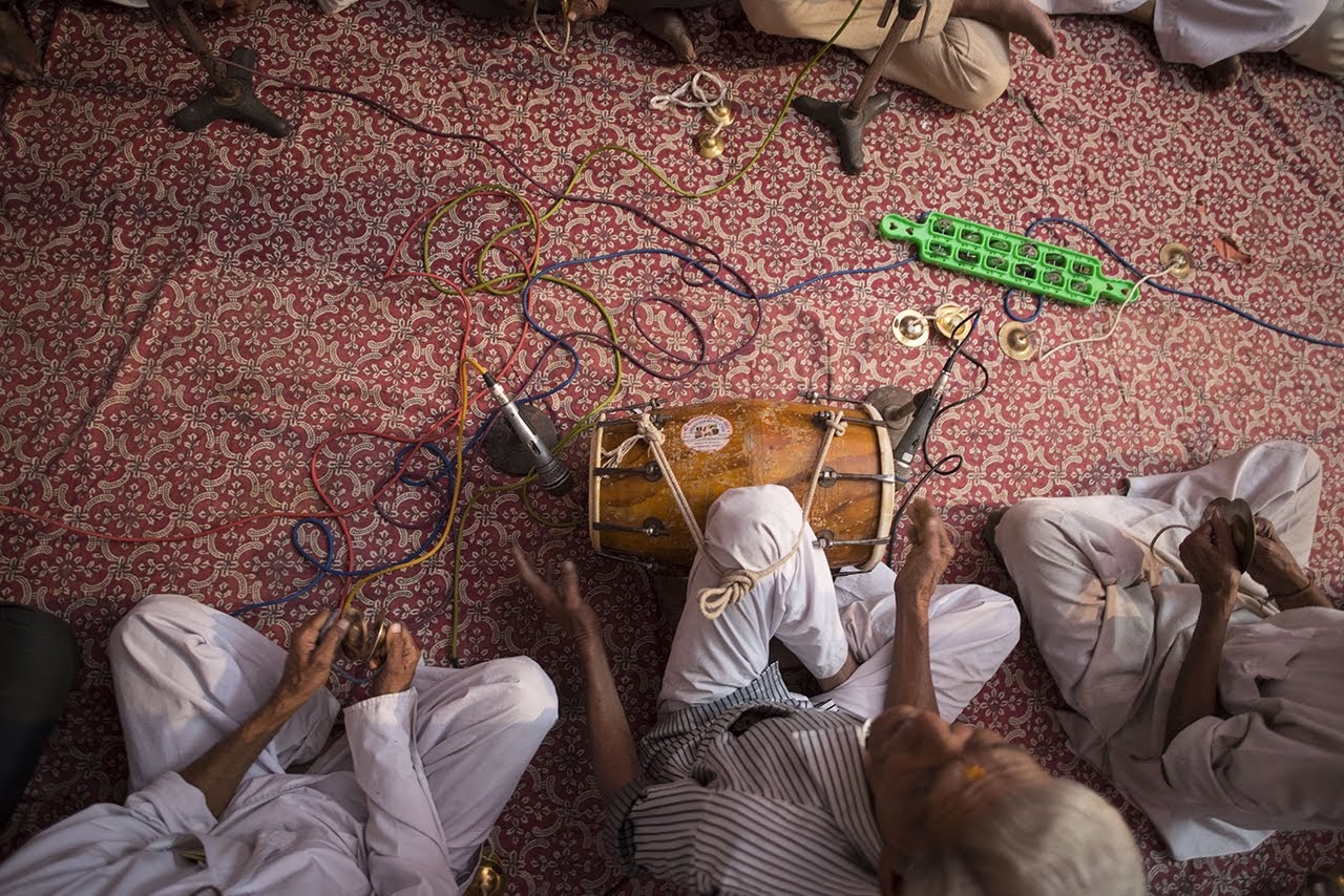 elderly men playing music atop a jajam